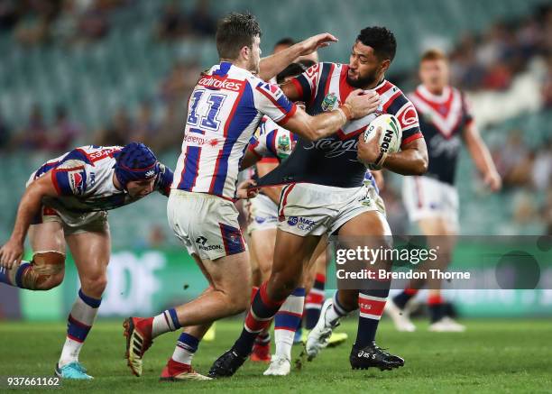 Isaac Liu of the Roosters is tackled by the Knights defence during the round three NRL match between the Sydney Roosters and the Newcastle Knights at...