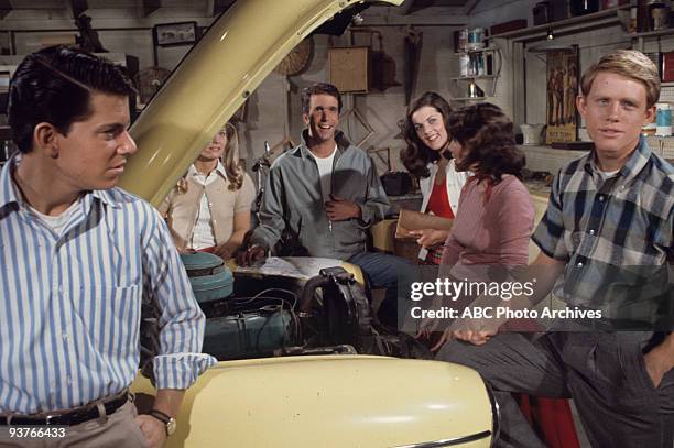 Open House" - Season Two - 5/28/74 The cast stands around a yellow car with the hood up, Potsie , Richie Fonzie