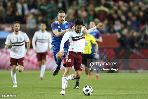 Rodolfo Pizarro of Mexico and Sverrir Ingi Ingason of Iceland fight for the ball during the friendly match between Mexico and Iceland at Levi's...