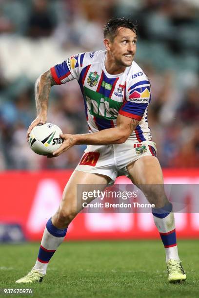 Mitchell Pearce of the Knights runs the ball during the round three NRL match between the Sydney Roosters and the Newcastle Knights at Allianz...