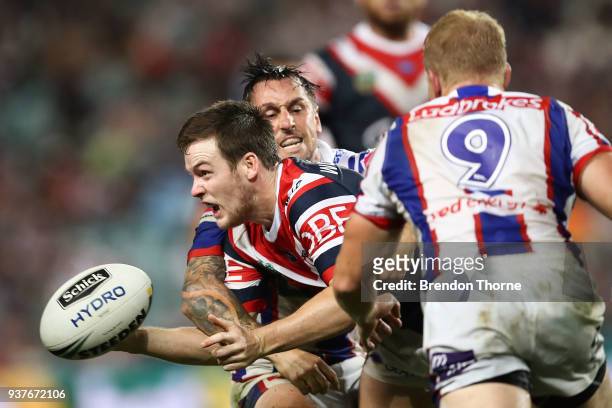 Luke Keary of the Roosters offloads the ball during the round three NRL match between the Sydney Roosters and the Newcastle Knights at Allianz...