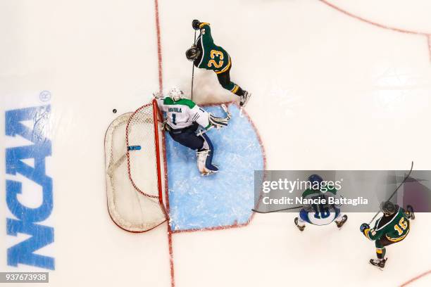 Photos via Getty Images action from above as St. Norbert College's Kurt Black has a goal attempt blocked by Salve Regina University goalie Blake...