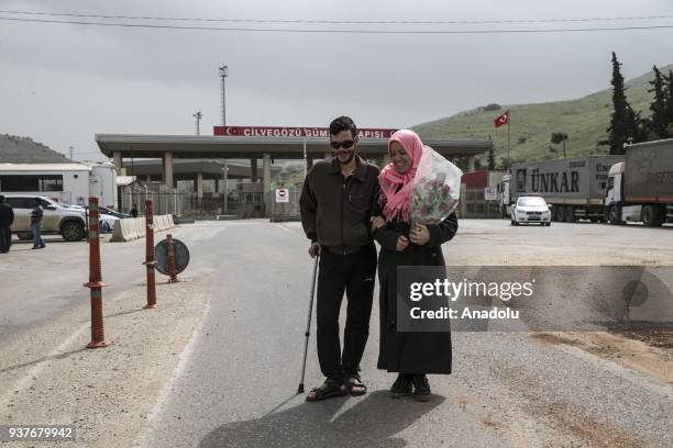 Year old Faisal Halef who lost his eyes and having difficulties to walk as a result of an airstrike held by war planes in Syria, welcomes Fatma...