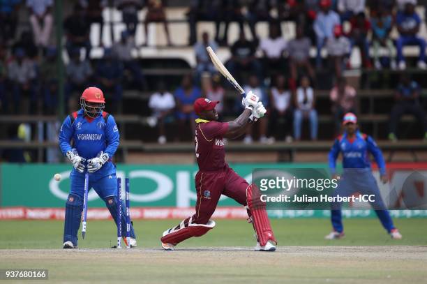 Muhammad Shahzad of Afghanistan looks on as Rovman Powell of The West Indies is dismissed during The ICC Cricket World Cup Qualifier Final between...