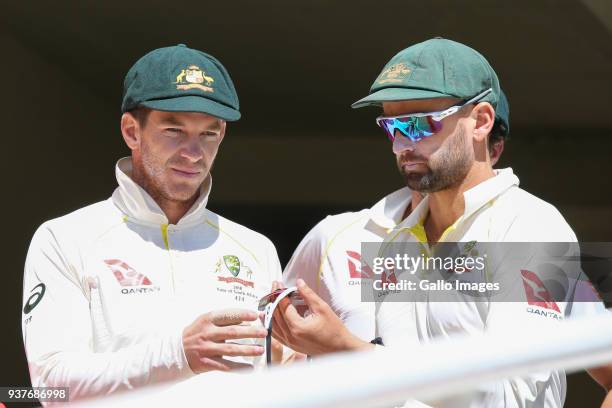 Tim Paine and Nathan Lyon from Australia during day 4 of the 3rd Sunfoil Test match between South Africa and Australia at PPC Newlands on March 25,...