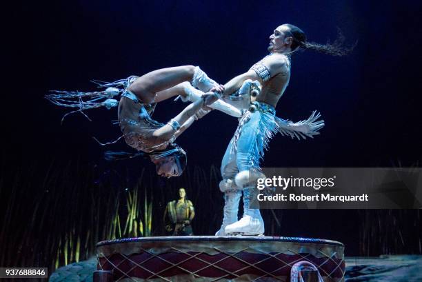 Denise Garcia Sorta and Massimiliano Medini perform on stage for the Cirque du Soleil 'Totem' show on March 22, 2018 in Barcelona, Spain.