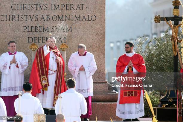 Pope Francis blesses the palms with holy water during the Palm Sunday Mass at St. Peter's Square on March 25, 2018 in Vatican City, Vatican. Pope...