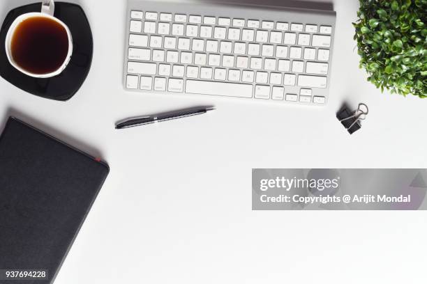 high angle view of professional business desk with computer keyboard, green plant, other office supplies copy space - desk from above stock pictures, royalty-free photos & images