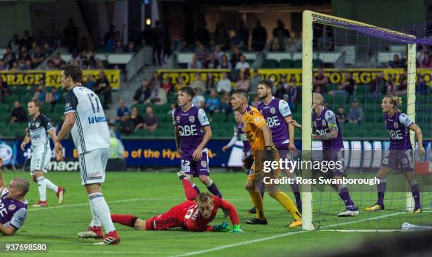 Goalkeeper Lawrence Thomas of the Victory looks for a goal opportunity as goalkeeper Liam Reddy of the Glory looks on during the round 24 A-League...