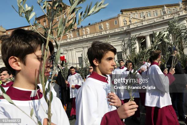 Altar boys attend Palm Sunday Mass held by Pope Francis at St. Peter's Square on March 25, 2018 in Vatican City, Vatican. Pope Francis on Sunday...