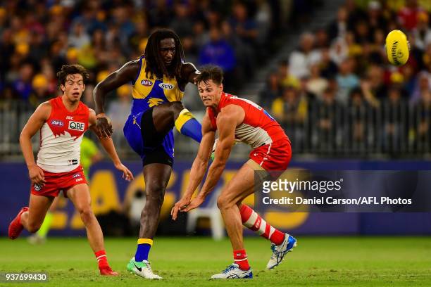 Nic Naitanui of the Eagles kicks the ball from the centre during the 2018 AFL round 01 match between the West Coast Eagles and the Sydney Swans at...