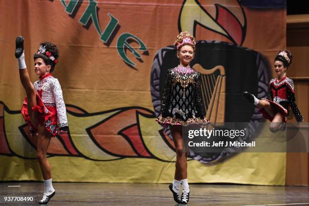 Competitor high kicks across the stage as she takes part in the World Irish Dancing Championships on March 25, 2018 in Glasgow, Scotland. The World...