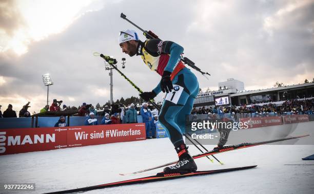 France's Martin Fourcade competes during the Men 15km Mass Start Competition event at the IBU Biathlon World Cup Final in Tyumen on March 25, 2018....