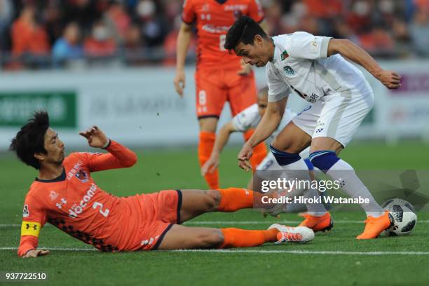 Kosuke Kikuchi of Omiya Ardija and Dudu of Avispa Fukuoka compete for the ball during the J.League J2 match between Omiya Ardija and Avispa Fukuoka...