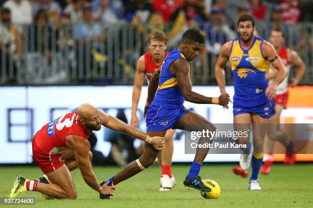 Jarrad McVeigh of the Swans and Liam Ryan of the Eagles contest for the ball during the round one AFL match between the West Coast Eagles and the...