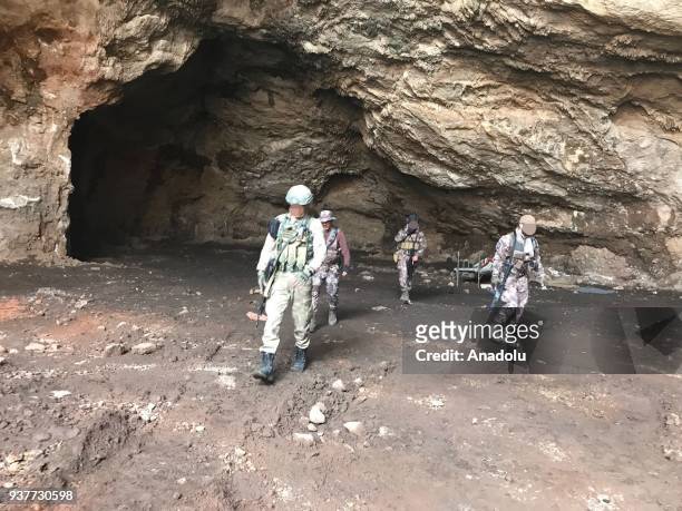 Turkish soldiers conduct search works for explosive ordnances, including improvised explosive devices and mines, in a cave after Turkish Armed Forces...