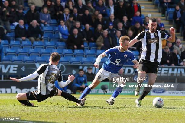 Matt Tootle of Notts County fouls Andy Kellett of Chesterfield in the penalty area during the Sky Bet League Two match between Chesterfield and Notts...