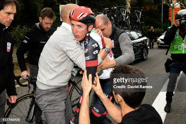 Daniel Martin of Ireland and Team UAE Team Emirates is helped by his team's doctor and stuff members after crashing descending Montjuich during the...