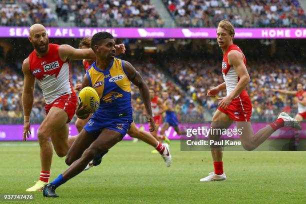 Liam Ryan of the Eagles avoids beimng tackled by Jarrad McVeigh of the Swans during the round one AFL match between the West Coast Eagles and the...