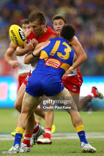 Luke Shuey of the Eagles tackles Kieren Jack of the Swans during the round one AFL match between the West Coast Eagles and the Sydney Swans at Optus...