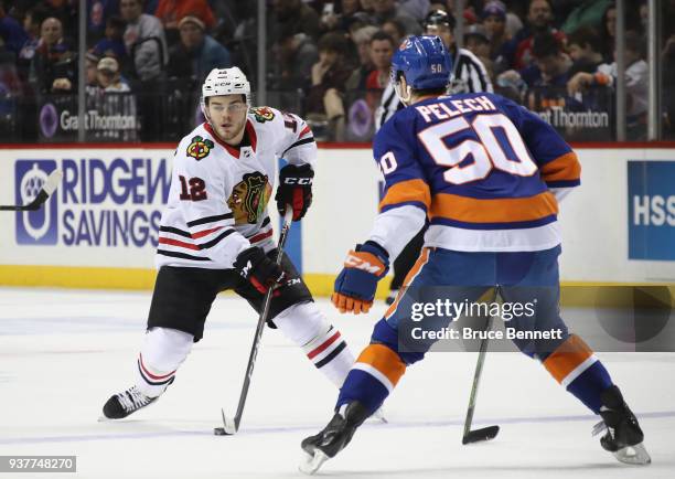 Alex DeBrincat of the Chicago Blackhawks skates against the New York Islanders at the Barclays Center on March 24, 2018 in the Brooklyn borough of...