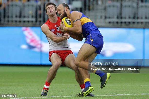 Will Schofield of the West Coast Eagles marks the ball under pressure from Dean Towers of the Swans during the round one AFL match between the West...