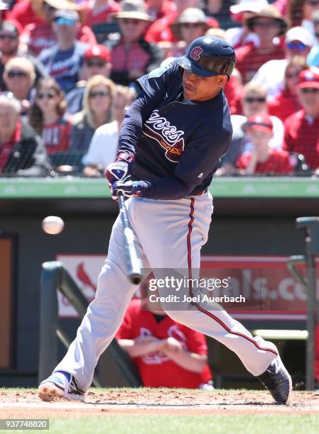 Ezequiel Carrera of the Atlanta Braves hits the ball against the St Louis Cardinals during a spring training game at Roger Dean Chevrolet Stadium on...