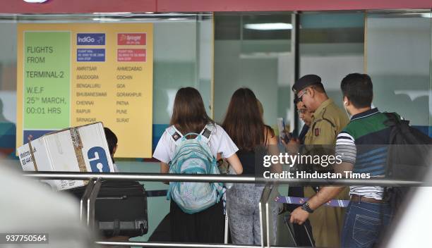 Passengers wait at the airport after IndiGo and SpiceJet airlines have partially moved their operations from T1 to the newly revamped T2 on Sunday at...