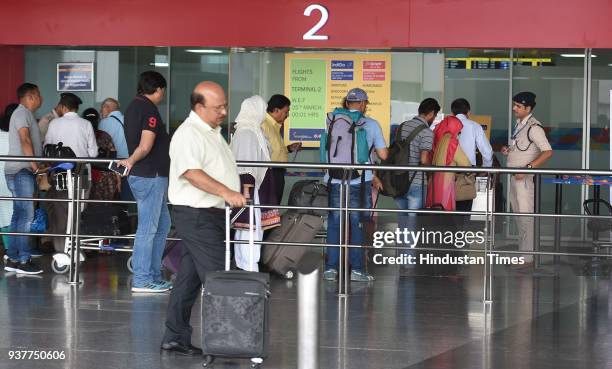 Passengers wait at the airport after IndiGo and SpiceJet airlines have partially moved their operations from T1 to the newly revamped T2 on Sunday at...