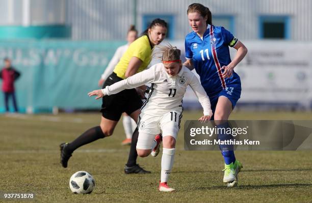 Vanessa Fudalla of Germany battles for the ball with Karolina Lea Vilhjalmsdottir of Iceland during the UEFA U17 Girl's European Championship...