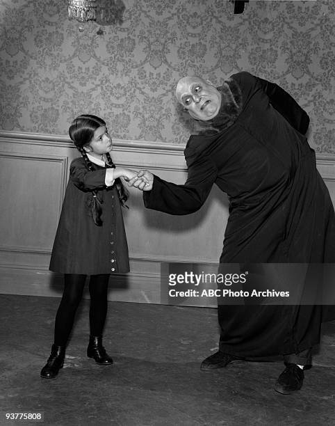The Addams Family "Fester Goes on a Diet" Season One, Uncle Fester shakes Wednesday"s hand.,