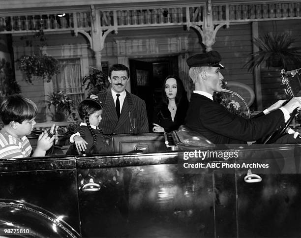 The Addams Family "Gomez the Politician" Season One., Gomez stands with Morticia Outside their car, while Wednesday Pugsley wait in the car while...