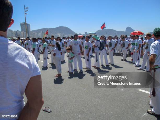 capoeira on copacabana beach, rio de janeiro - exhibition a human adventure stock pictures, royalty-free photos & images