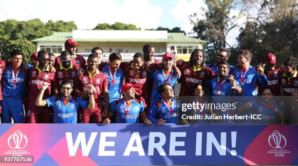 The victorious Afghanistan team mixes with members of The West Indies team after The ICC Cricket World Cup Qualifier Final between The West Indies...