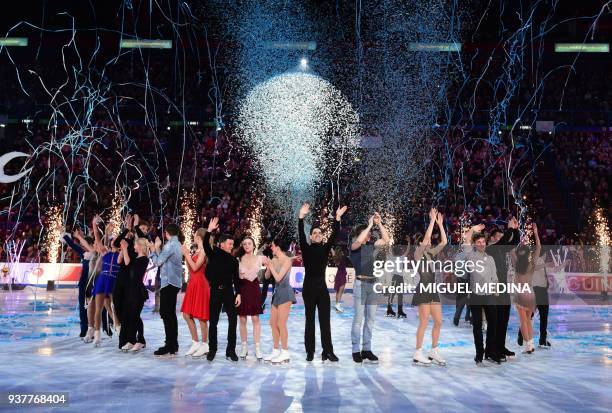 Skaters wave to the audience at an Exhibition Gala at The World Figure Skating Championships 2018 in Milan on March 25, 2018. / AFP PHOTO / MIGUEL...