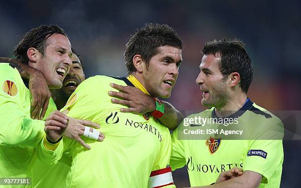 Benjamin Huggel , Marco Streller and Alexander Frei of FC Basel 1893 celebrate the opening goal during the UEFA Europa League group E match between...