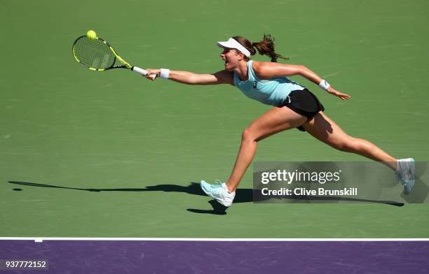 Johanna Konta of Great Britain plays a forehand against Elise Mertens of Belgium in their third round match during the Miami Open Presented by Itau...