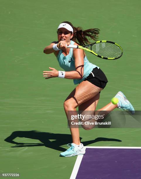 Johanna Konta of Great Britain plays a forehand against Elise Mertens of Belgium in their third round match during the Miami Open Presented by Itau...