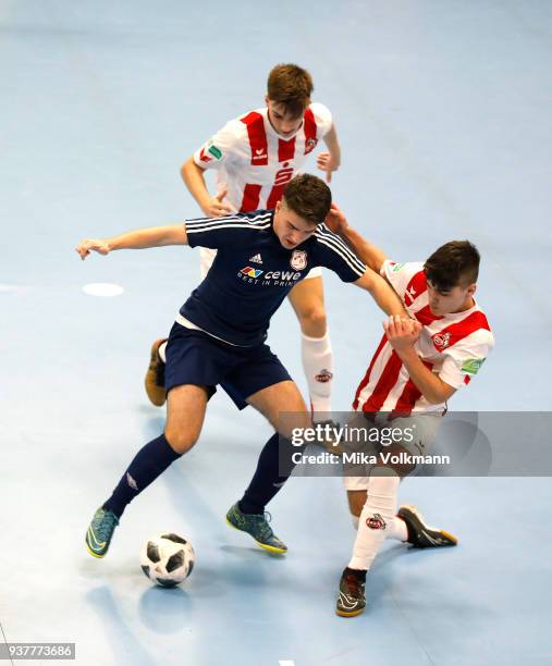 Jonas Berg of 1.FC Koeln challenges Erolind Olluri of Arsten during the final of the DFB Indoor Football match B-Junioren between 1.FC Koeln and TuS...