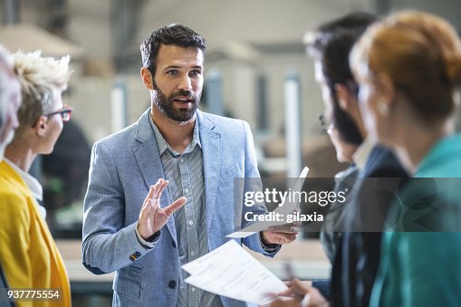 Factory staff meeting. Factory staff meeting.