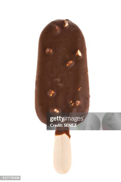 chocolate covered ice cream against white background - helado condición fotografías e imágenes de stock