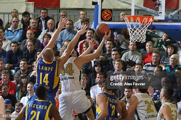 Maciej Lampe, #14 of Maccabi Electra competes with Matt Walsh, #44 of Union Olimpija during the Euroleague Basketball Regular Season 2009-2010 Game...