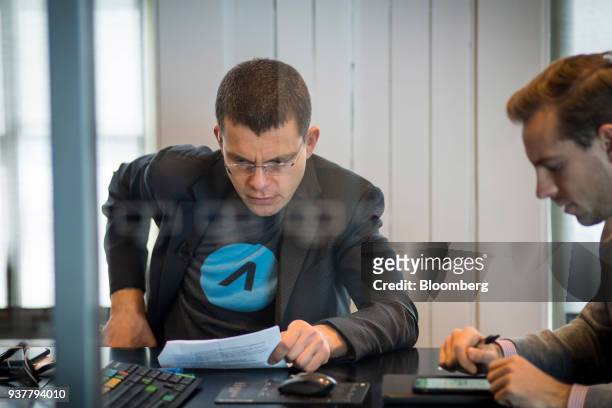 Max Levchin, co-founder of PayPal Inc. And chief executive officer of Affirm Inc., left, views notes ahead of a Bloomberg Technology television...