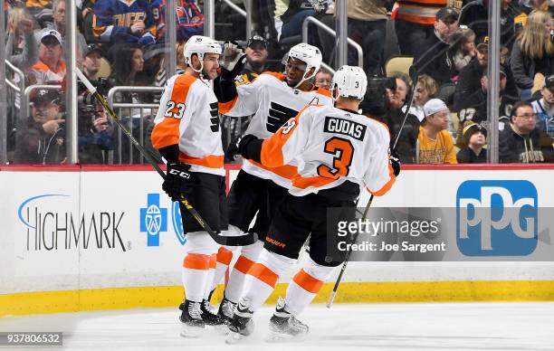 Brandon Manning of the Philadelphia Flyers celebrates his first period goal against the Pittsburgh Penguins at PPG Paints Arena on March 25, 2018 in...