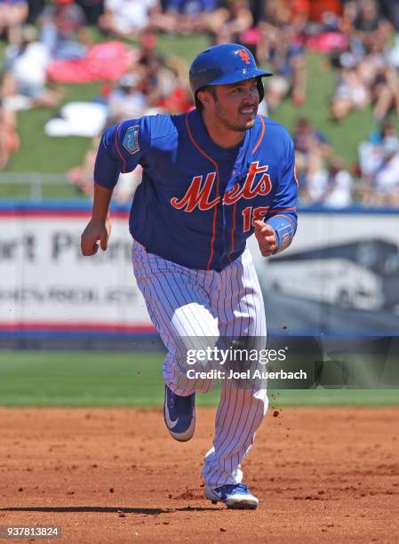 Travis d'Arnaud of the New York Mets runs the bases against the St Louis Cardinals during the second inning of a spring training game at First Data...