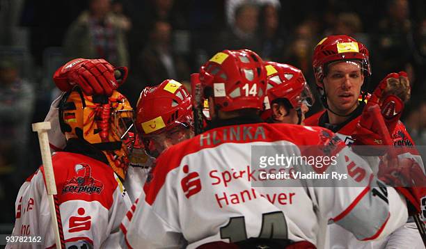 Scorpions players celebrate their goali Levent Szuper after winning the Deutsche Eishockey Liga game between Adler Mannheim and Hannover Scorpions at...