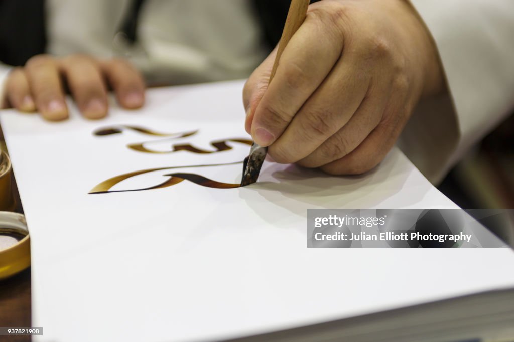 Traditional Arabic Script A Man Writes Out Traditional Arabic Script High-Res Stock Photo - Getty ...