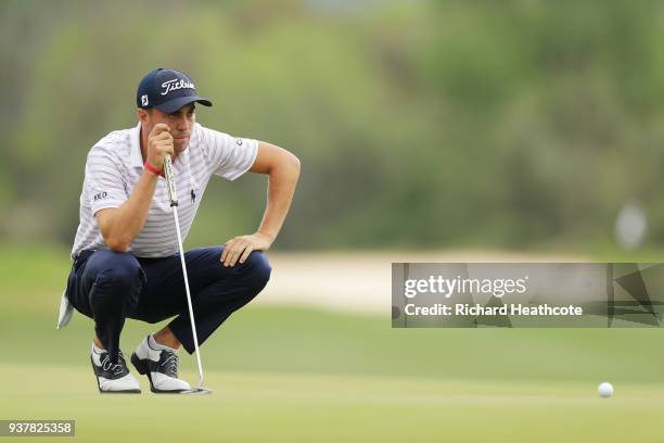 Justin Thomas of the United States lines up a putt on the 15th green during his semifinal round match against Bubba Watson of the United States in...