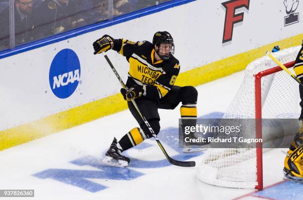 Cooper Watson of the Michigan Tech Huskies skates against the Notre Dame Fighting Irish during the NCAA Division I Men's Ice Hockey East Regional...