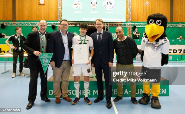 People pose as awards are handed out during the DFB Indoor Football ceremony on March 25, 2018 in Gevelsberg, Germany.